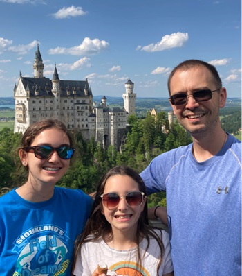Jeff Harstad smiling with his family.