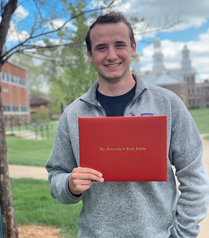 Success story Mason Rogers smiling.