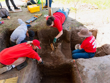 This photo shows another view of the group of students working together to discover artifacts during the USD Archaeology Field School.