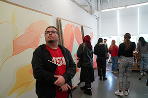 USD art student takes a picture in an art gallery in NYC.