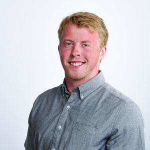 Caileb Reilly faces the camera with a nice smile for his professional headshot.