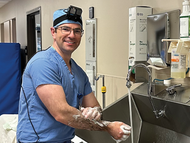 Dr. Skelley prepares for a surgery while wearing a GoPro camera on his head.