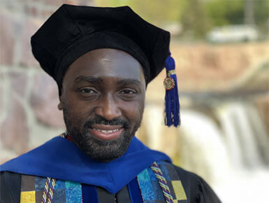 McHale Davis poses for a photo in his graduation regalia.