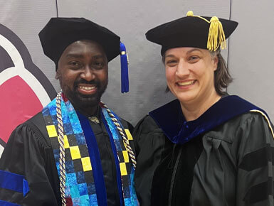 McHale Davis poses for a photo with Gabrielle Strouse, Ph.D., associate professor in the Department of Counseling and Psychology Education and his dissertation chair.