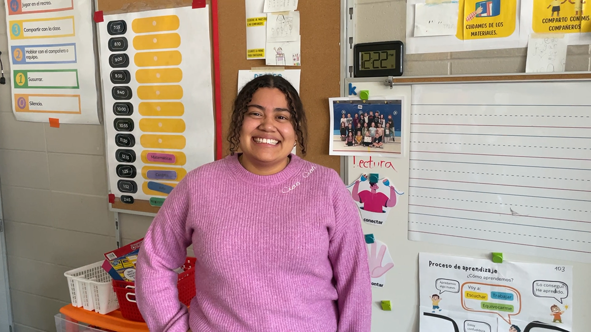 Ana Rodriguez Garcia poses for a photo in an elementary classroom.