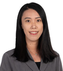 Agnes Bao poses for her professional photo while wearing a gray blazer.
