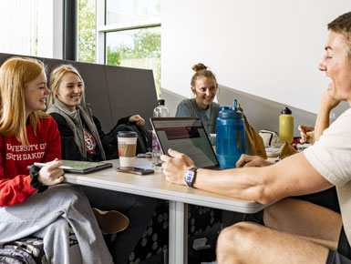 USD students sit together at the Muenster University Center.